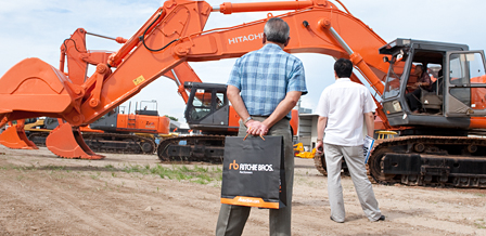  inspect the equipment at the auction site